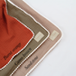 ORGANIC MUSLIN BLANKET WITH POM POMS